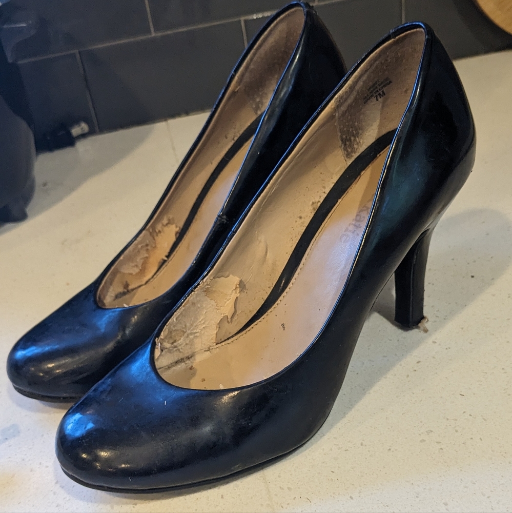 Kelly and Katie black patent pumps